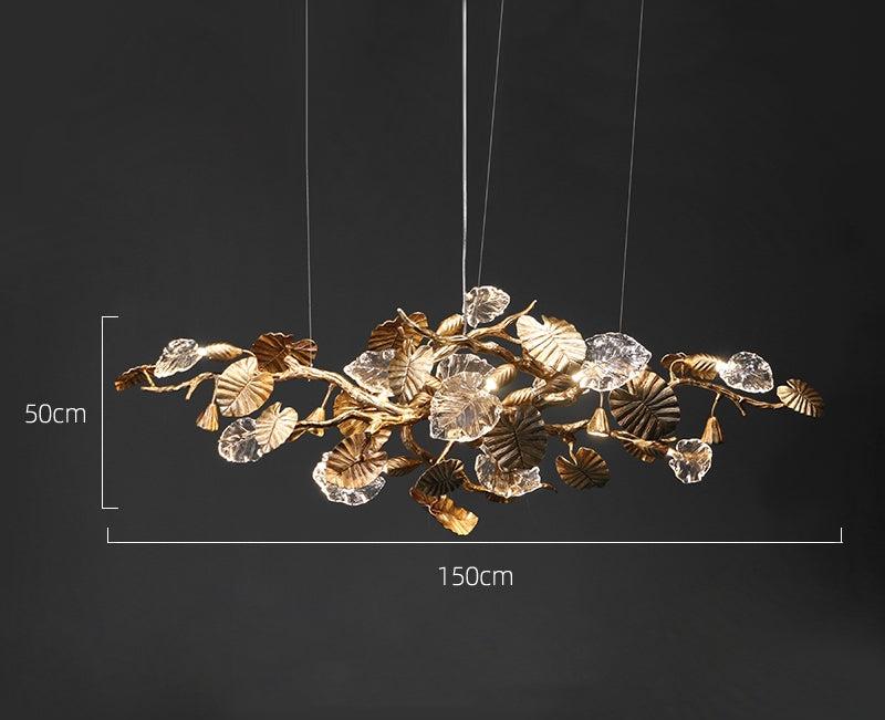 Elegant Lotus chandelier featuring delicate lotus leaf pendants made of transparent material, capturing light with a crystalline shimmer. The slender, organic brass copper branch adds warmth, while the LED lights provide a cool glow. Ideal centerpiece for a sophisticated dining area or tranquil bedroom retreat.