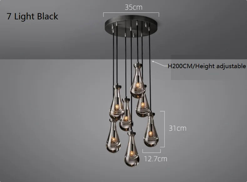 Raine Modern Chandelier with K9 crystal prisms and sleek metal design, perfect for high-ceiling living rooms, foyers, and upscale interiors. Adjustable height, energy-efficient LED compatible.