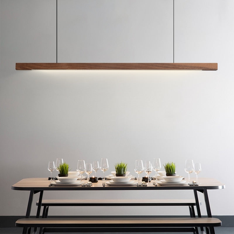 Lights of Scandinavia - Lindö - Modern long hanging dining room pendant light ala Nordic style. Will also make a good fit for office areas, restaurants and bars. Pine wood or black walnut Use the included remote to change color temperature between cold, neutral and warm light.